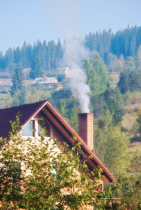 a chimney with smoke coming out
