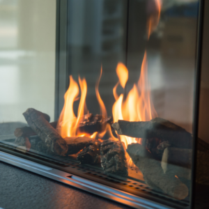 close up view of lit gas fireplace logs