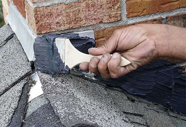 Technician fixing chimney leaks