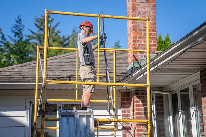 Northeastern-Chimney - Technician working on chimney Repairs