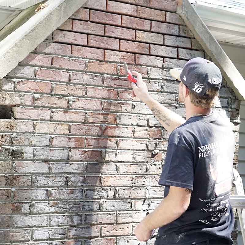 Northeastern-Chimney-Technician-working-on-Bricks-Repair Technician-working-on-Bricks-Repair